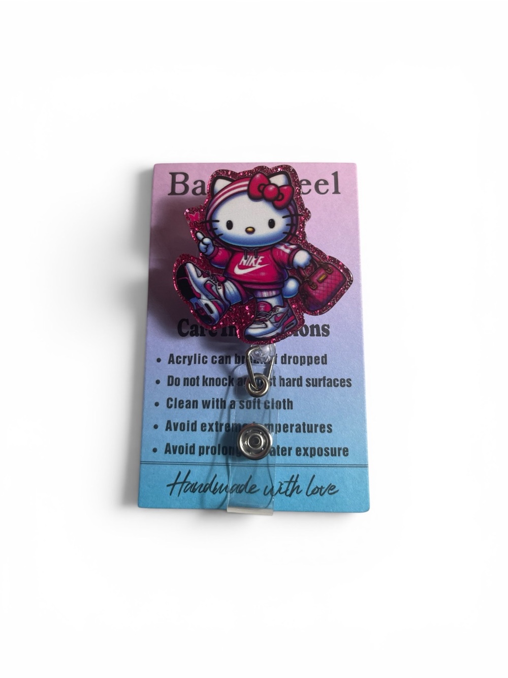 Sanrio Hello Kitty Pink and White Badge Reel